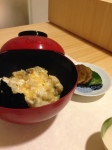 Rice with egg and nori (seaweed) on top along with more Hamo and pickled chestnut